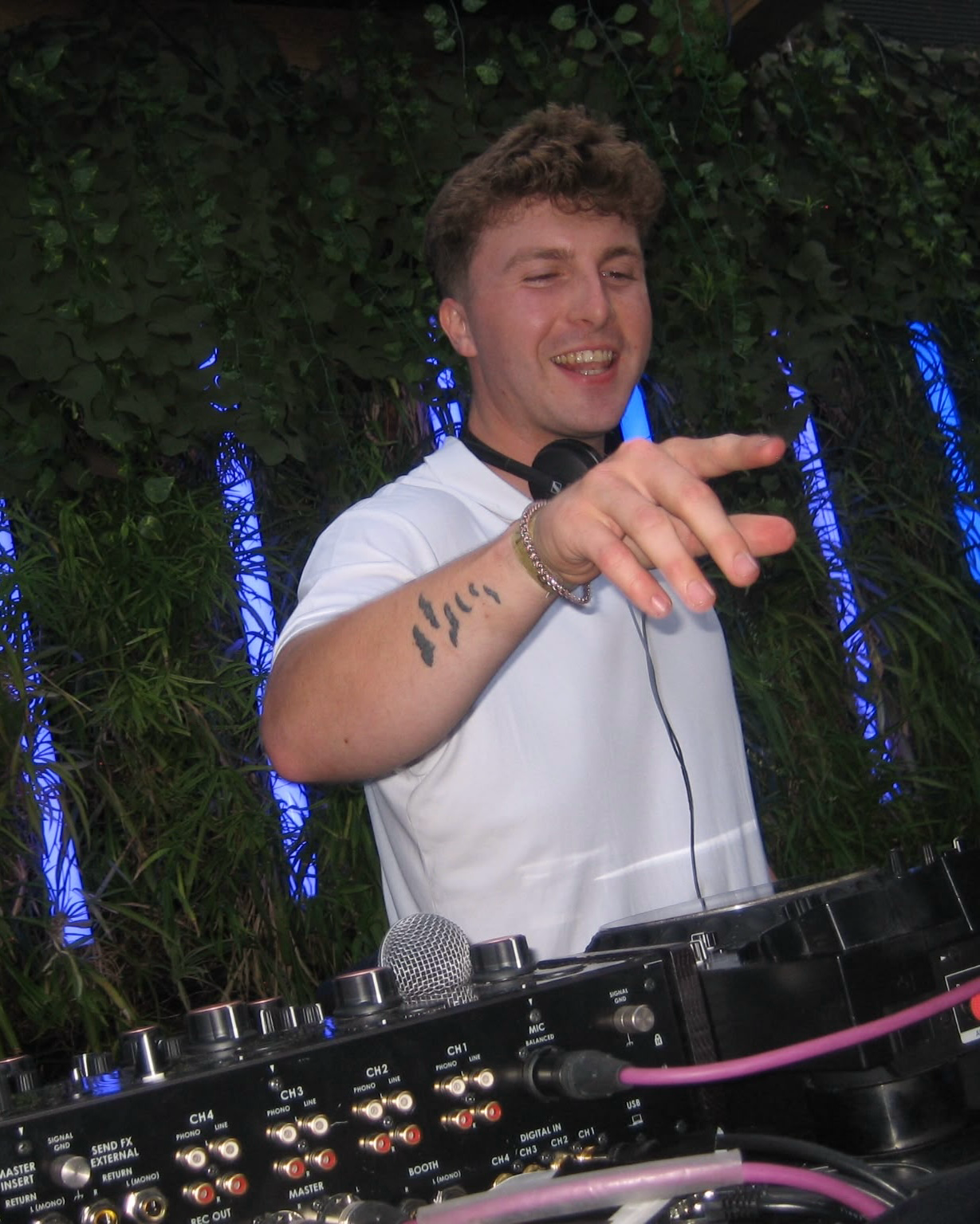 Ethan Gray behind the DJ decks